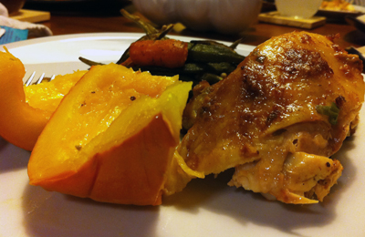 Plated peanut chicken and baked pumpkin